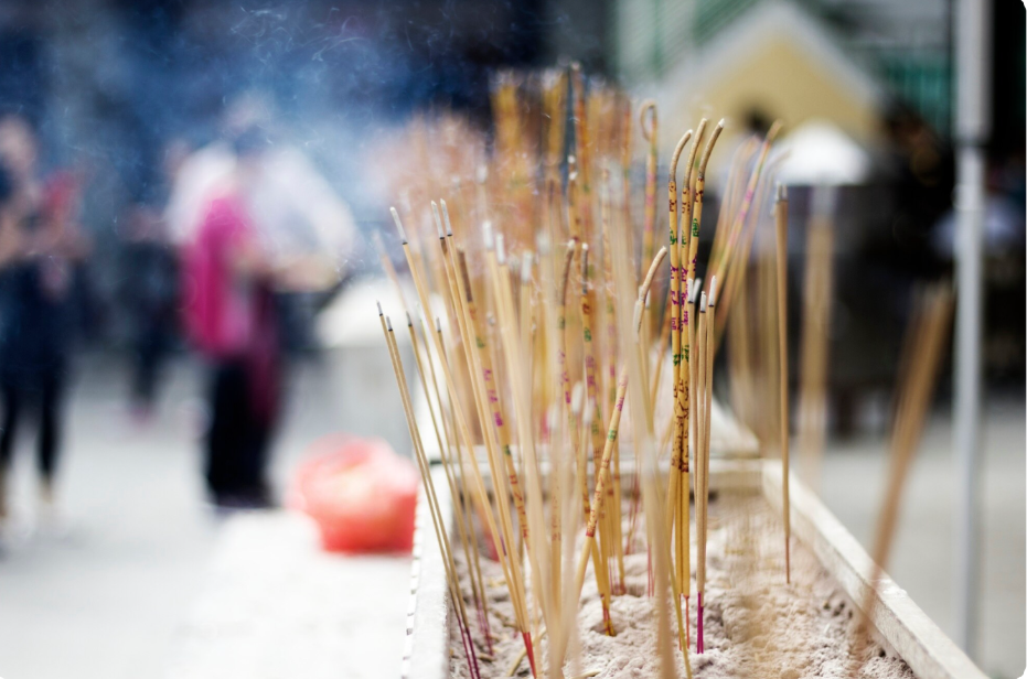 Burning incense sticks for the deceased